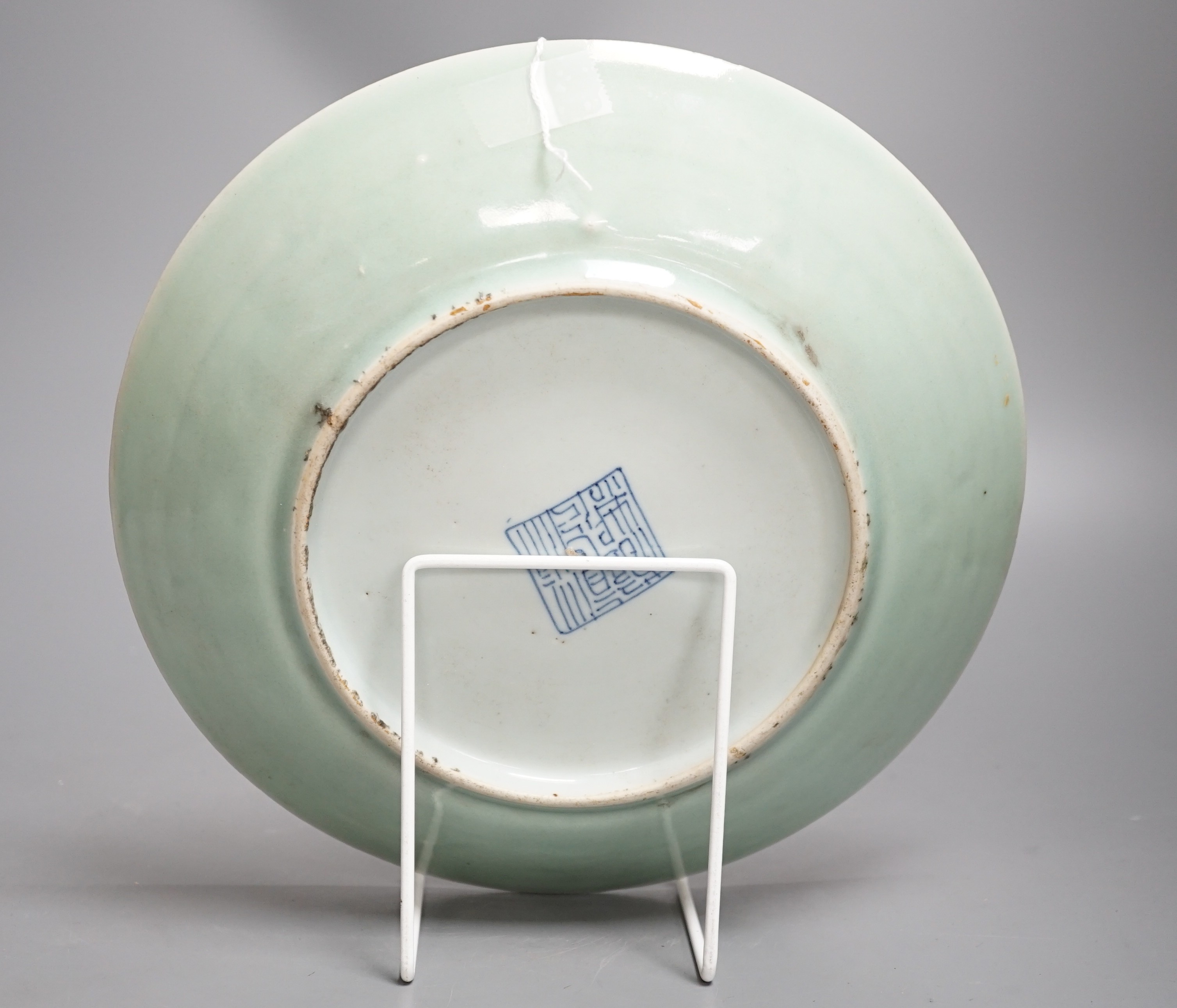 A Chinese celadon ground famille rose plate, Daoguang mark and of the period. 26cm diameter